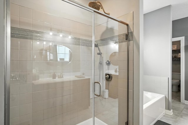 618 Ludham Trl, Pickerington, OH 43147 - bathroom featuring a garden tub, a shower stall, and tile patterned flooring