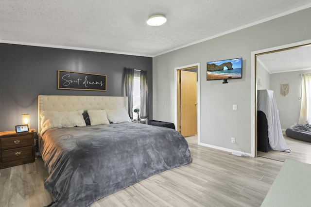 6471 Graham Rd, Mount Vernon, OH 43050 - bedroom featuring a textured ceiling, crown molding, and wood finished floors