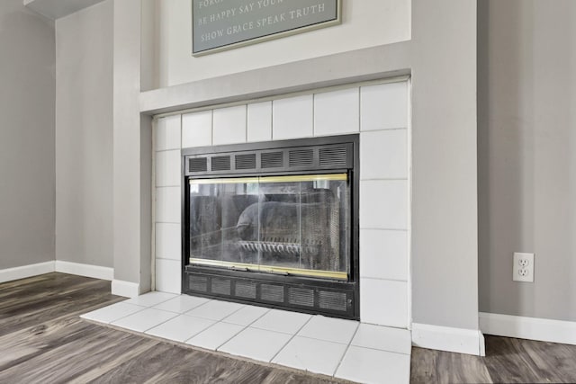 6471 Graham Rd, Mount Vernon, OH 43050 - detailed view of a tiled fireplace and wood finished floors