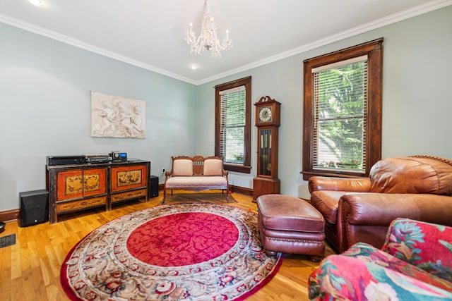 117 E Frankfort St, Columbus, OH 43206 - living area featuring a chandelier, wood finished floors, ornamental molding, and recessed lighting