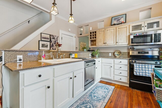 117 E Frankfort St, Columbus, OH 43206 - kitchen featuring appliances with stainless steel finishes, crown molding, open shelves, a peninsula, and decorative light fixtures