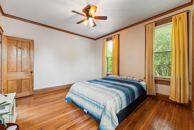 117 E Frankfort St, Columbus, OH 43206 - bedroom featuring hardwood / wood-style flooring, ornamental molding, and ceiling fan