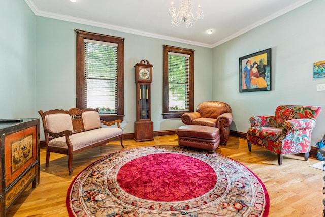 117 E Frankfort St, Columbus, OH 43206 - sitting room with light wood-type flooring, ornamental molding, and a chandelier