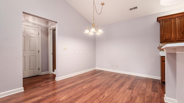 74 Stonington Cir, Newark, OH 43055 - unfurnished dining area with wood finished floors, a chandelier, and vaulted ceiling