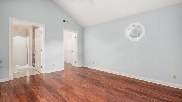 74 Stonington Cir, Newark, OH 43055 - unfurnished bedroom with a walk in closet, wood finished floors, lofted ceiling, a closet, and a ceiling fan