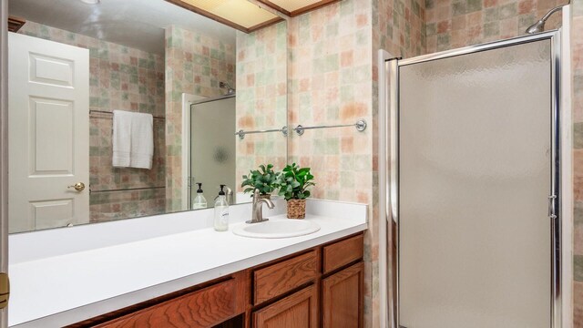 74 Stonington Cir, Newark, OH 43055 - full bath featuring a stall shower, vanity, and tile walls