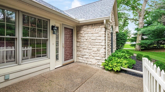 74 Stonington Cir, Newark, OH 43055 - view of exterior entry with a shingled roof and stone siding