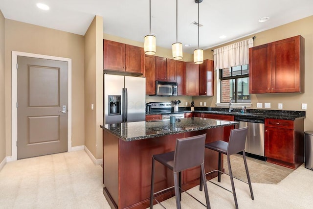 250 Daniel Burnham Sq Unit 402, Columbus, OH 43215 - kitchen with stainless steel appliances, a kitchen island, decorative light fixtures, a breakfast bar, and recessed lighting