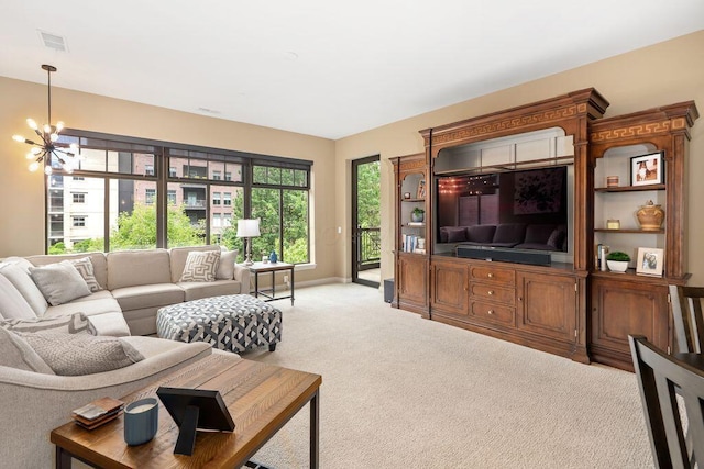 250 Daniel Burnham Sq Unit 402, Columbus, OH 43215 - living room featuring a chandelier and carpet flooring