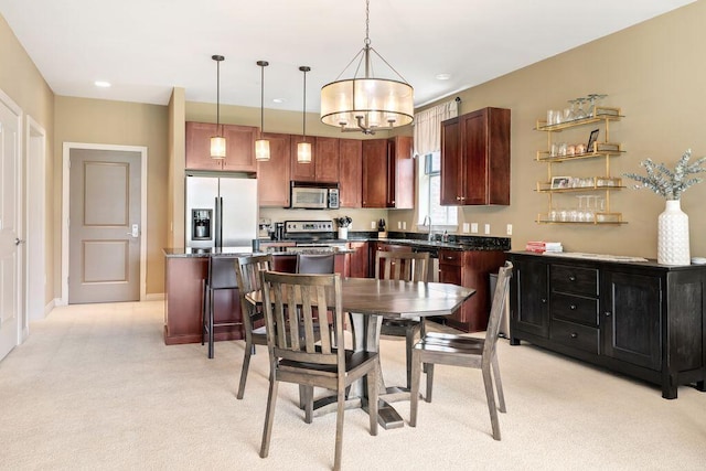 250 Daniel Burnham Sq Unit 402, Columbus, OH 43215 - dining space featuring light carpet and a chandelier