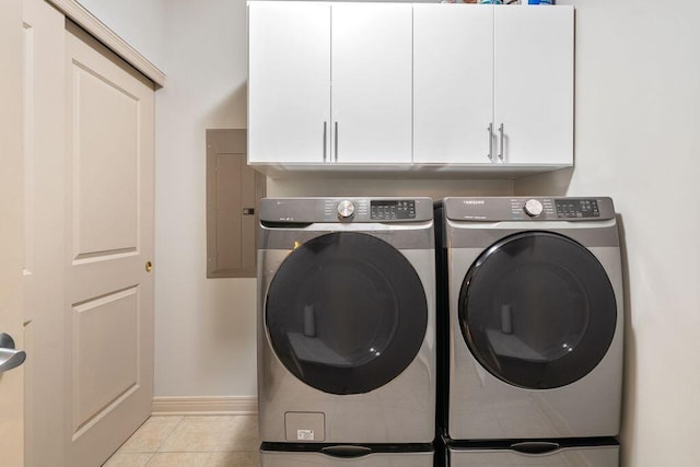 250 Daniel Burnham Sq Unit 402, Columbus, OH 43215 - laundry area featuring cabinet space, separate washer and dryer, electric panel, and light tile patterned floors