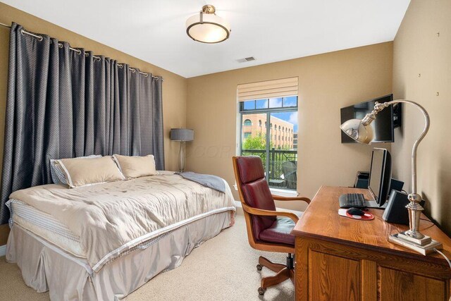 250 Daniel Burnham Sq Unit 402, Columbus, OH 43215 - bedroom with carpet floors and a desk