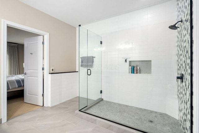 250 Daniel Burnham Sq Unit 402, Columbus, OH 43215 - ensuite bathroom featuring a shower stall and marble finish flooring