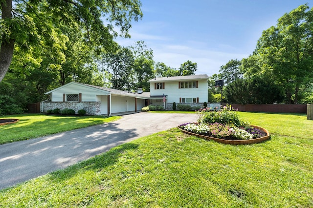 298 Flint Ridge Dr, Columbus, OH 43230 - view of front of house featuring asphalt driveway and a garage