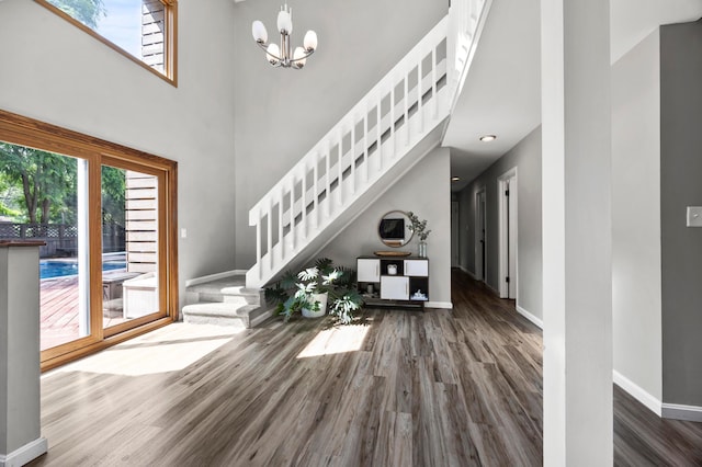 298 Flint Ridge Dr, Columbus, OH 43230 - entryway featuring wood finished floors, healthy amount of natural light, stairway, and a high ceiling