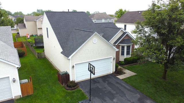 486 Ruffin Dr, Galloway, OH 43119 - traditional-style home featuring roof with shingles, a garage, and driveway