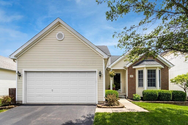 486 Ruffin Dr, Galloway, OH 43119 - view of front of property with driveway, an attached garage, and a front yard
