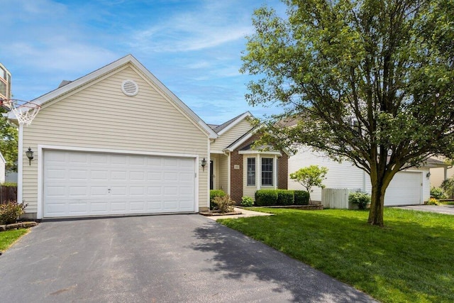486 Ruffin Dr, Galloway, OH 43119 - view of front of home featuring driveway, a front yard, and an attached garage