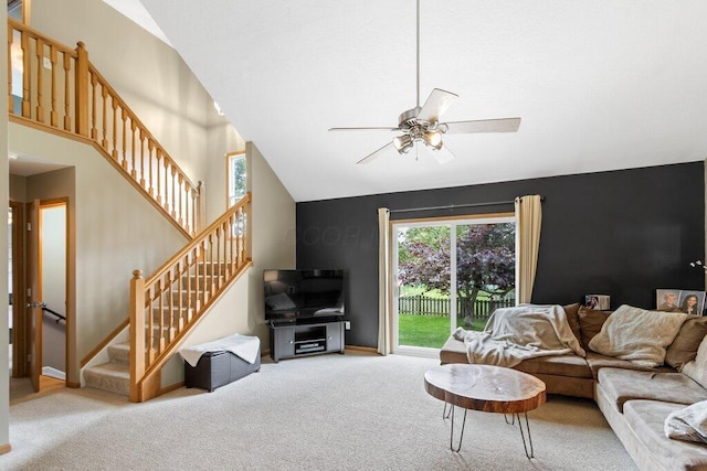 486 Ruffin Dr, Galloway, OH 43119 - carpeted living room with a ceiling fan, vaulted ceiling, and stairs