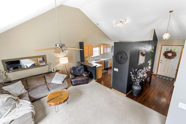 486 Ruffin Dr, Galloway, OH 43119 - living area featuring dark wood-style flooring, ceiling fan, and high vaulted ceiling