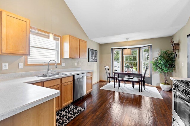 486 Ruffin Dr, Galloway, OH 43119 - kitchen featuring stainless steel appliances, dark wood-style floors, light countertops, lofted ceiling, and pendant lighting