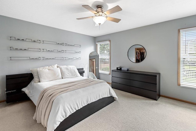 486 Ruffin Dr, Galloway, OH 43119 - carpeted bedroom featuring multiple windows and ceiling fan