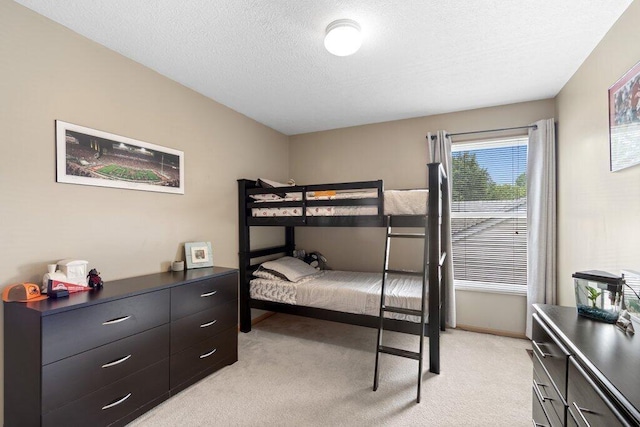 486 Ruffin Dr, Galloway, OH 43119 - bedroom featuring light colored carpet and a textured ceiling
