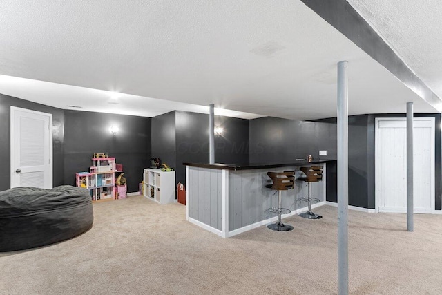 486 Ruffin Dr, Galloway, OH 43119 - finished basement with carpet flooring, a dry bar, and a textured ceiling