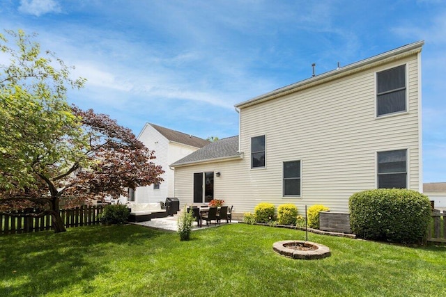 486 Ruffin Dr, Galloway, OH 43119 - back of property featuring a patio and an outdoor living space with a fire pit