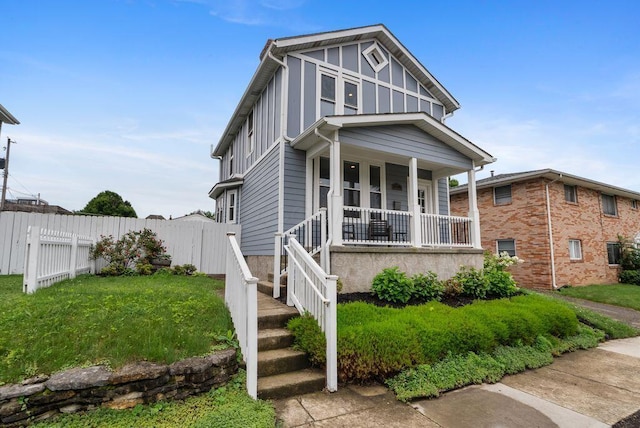 497 E Kossuth St, Columbus, OH 43206 - view of front of property featuring board and batten siding and covered porch