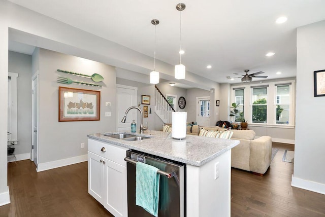 497 E Kossuth St, Columbus, OH 43206 - kitchen with stainless steel dishwasher, dark wood-style flooring, recessed lighting, white cabinetry, and ceiling fan