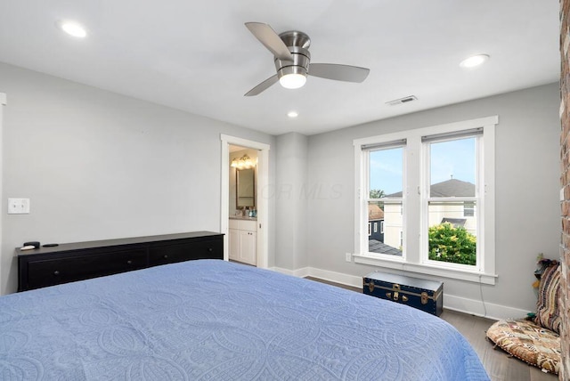 497 E Kossuth St, Columbus, OH 43206 - bedroom with wood finished floors, recessed lighting, ceiling fan, and ensuite bathroom