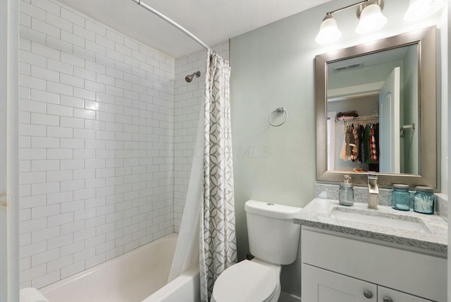 497 E Kossuth St, Columbus, OH 43206 - bathroom featuring vanity, shower / bath combo with shower curtain, and a spacious closet