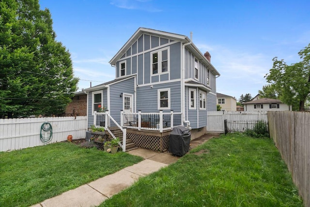 497 E Kossuth St, Columbus, OH 43206 - rear view of property with a wooden deck, a fenced backyard, a chimney, a gate, and board and batten siding