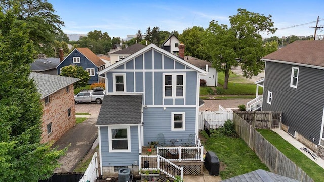 497 E Kossuth St, Columbus, OH 43206 - rear view of property with a fenced backyard, a shingled roof, and a wooden deck