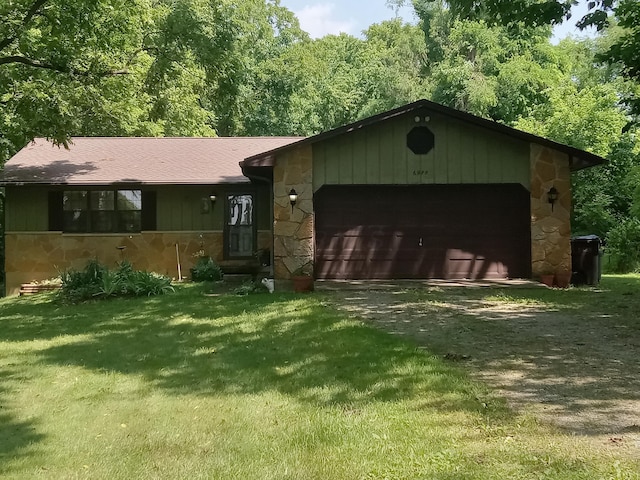 6978 Cook-Jones Rd, Waynesville, OH 45068 - single story home featuring stone siding, dirt driveway, an attached garage, and a front lawn