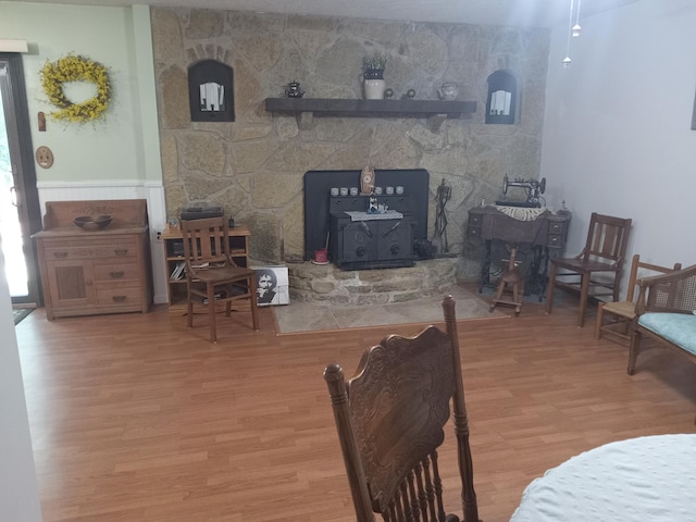6978 Cook-Jones Rd, Waynesville, OH 45068 - living room featuring a wood stove and wood finished floors