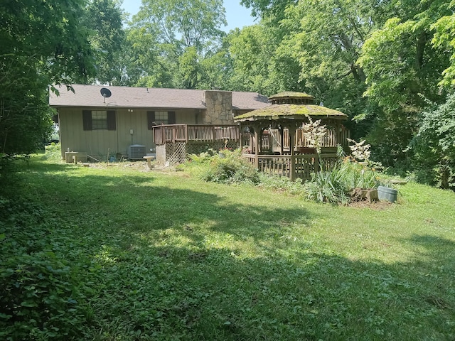 6978 Cook-Jones Rd, Waynesville, OH 45068 - back of property with a gazebo, a lawn, a deck, and board and batten siding