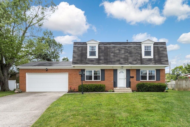 3748 Wagner Ct, Grove City, OH 43123 - colonial inspired home featuring roof with shingles, an attached garage, concrete driveway, and brick siding