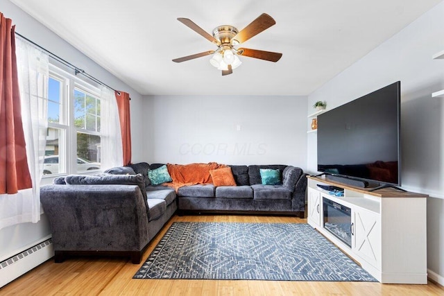 3748 Wagner Ct, Grove City, OH 43123 - living room featuring baseboard heating, ceiling fan, and wood finished floors