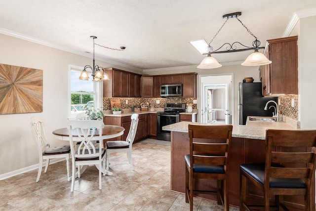 2591 Apple Valley Dr, Howard, OH 43028 - kitchen featuring stainless steel appliances, decorative backsplash, ornamental molding, a peninsula, and pendant lighting