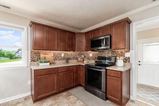 2591 Apple Valley Dr, Howard, OH 43028 - kitchen featuring stainless steel appliances, backsplash, and crown molding