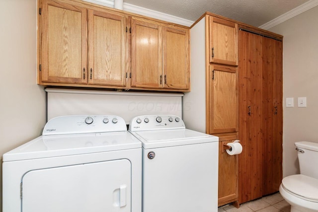 2591 Apple Valley Dr, Howard, OH 43028 - laundry area featuring washer and dryer, crown molding, and light tile patterned floors