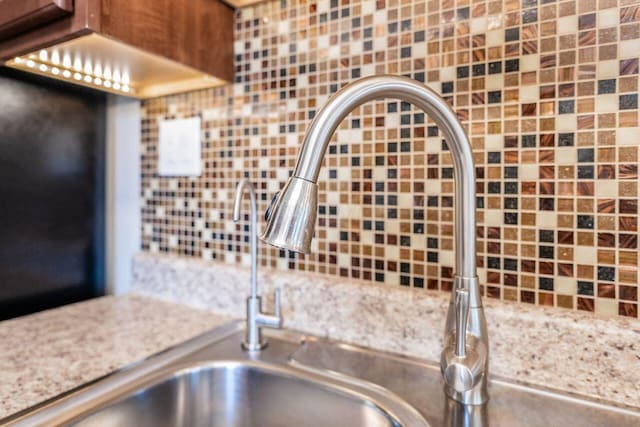 2591 Apple Valley Dr, Howard, OH 43028 - kitchen view of tasteful backsplash and light stone counters