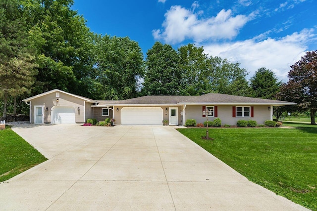2591 Apple Valley Dr, Howard, OH 43028 - ranch-style house with an attached garage, a front yard, and driveway