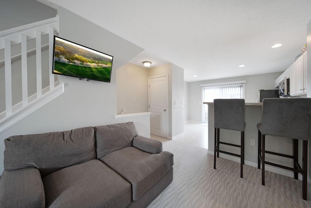 6295 Royal Tern Xing, Columbus, OH 43230 - living area with light carpet, recessed lighting, and stairway