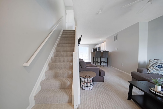 6295 Royal Tern Xing, Columbus, OH 43230 - carpeted living area with stairway and baseboards