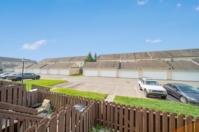 6295 Royal Tern Xing, Columbus, OH 43230 - fenced yard featuring community garages and a residential view