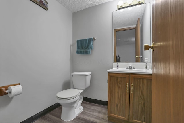 224 Macandrews Way Unit 60A, Blacklick, OH 43004 - half bath featuring a textured ceiling, vanity, and wood finished floors