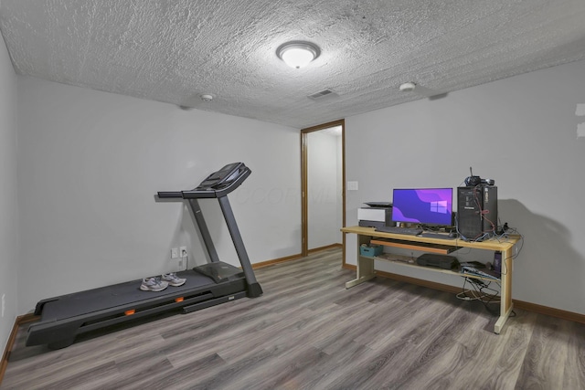 224 Macandrews Way Unit 60A, Blacklick, OH 43004 - exercise area with wood finished floors and a textured ceiling